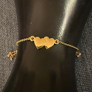Crown Trifari Bracelet or Anklet in Gold Tone with 2 interlocking Hearts.